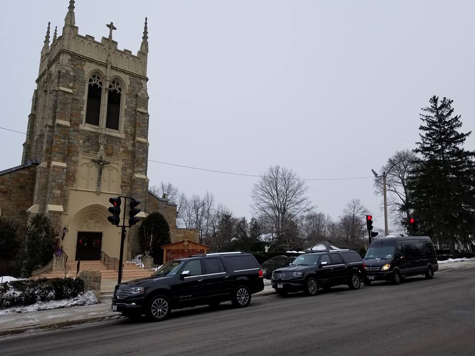 A church with cars parked on the side of it